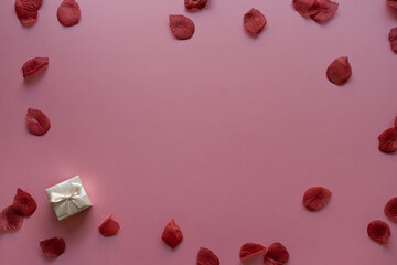 Valentine's day card background with rose petals and gift box | Top View