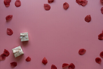 Valentine's day card background with rose petals and gift box | Top View