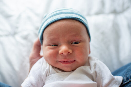 Cute Newborn Baby Has a Smirk on his Face