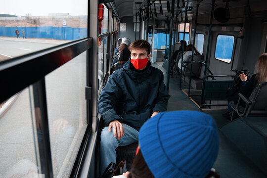 Man riding bus during pandemic