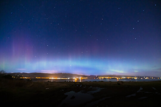 a view of the aurora borealis in the north west highlands of scotland during a clear spring night