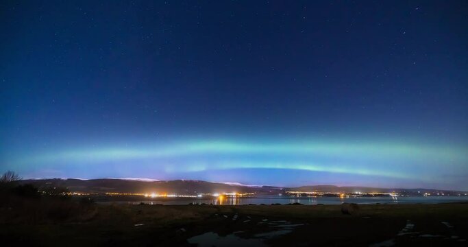 a view of the aurora borealis in the north west highlands of scotland during a clear spring night