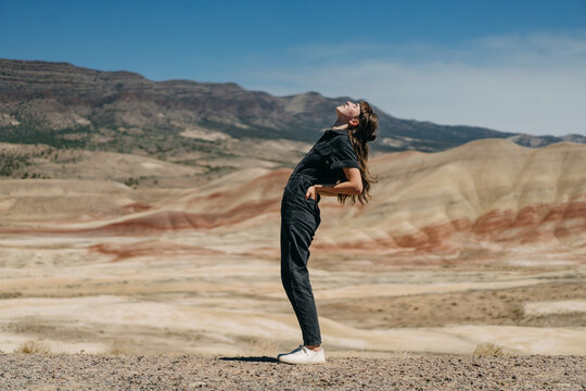Person in Jumpsuit Bending Backwards