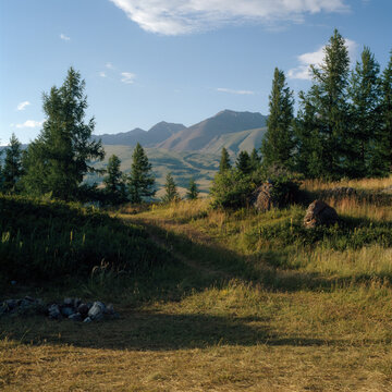 Agricultural field in mountains at sunset
