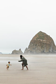 Mother and Son Playing on Beach
