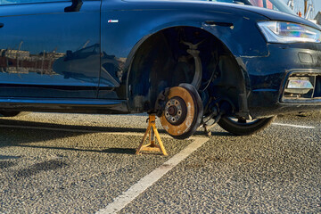 A car is missing a wheel