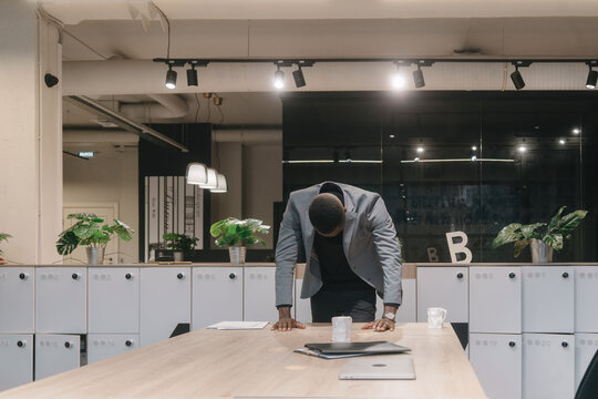 Lonely black man in workspace