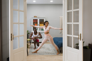 the girl and the guy are doing physical exercises
