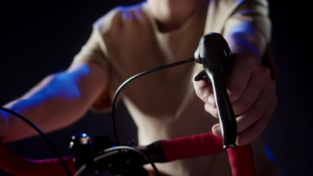 EEG topographer for examining brain, making electrogram of scalp activity. Researching of brain work, sportsman riding bicycle in electroencephalography headset. Rehabilitation after damage in sport.