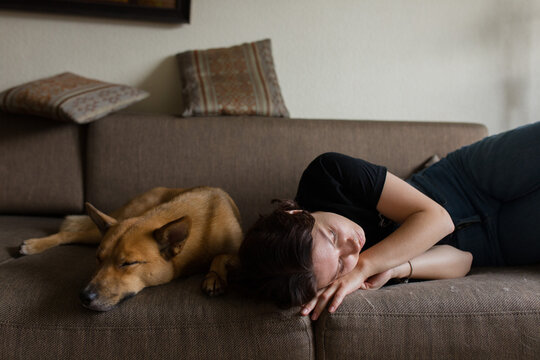 girl sleeping with a dog
