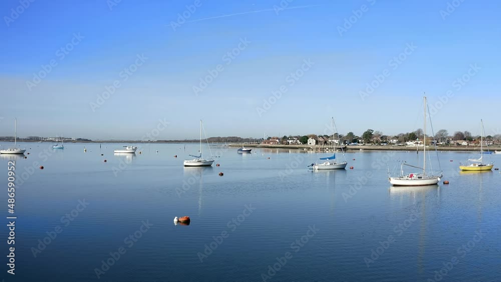 Poster Yachts and Sailing boats in the calm and clear Emsworth estuary on a sunny and still early morning, Aerial video. - Posters