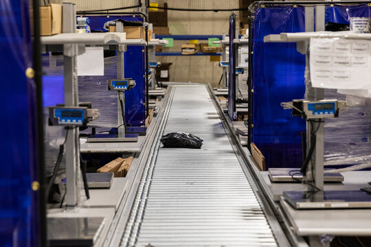 Conveyor Belt with package at ecommerce warehouse 