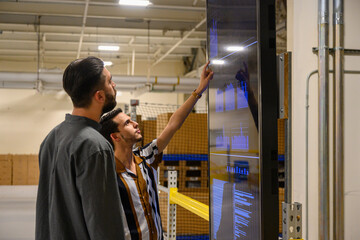 Team Meeting at Status board at warehouse