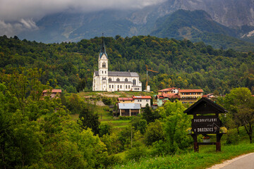 Fototapeta premium San Fermin Church in the mountain village of Drežnica, beautiful panoramic view, Slovenia