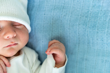 Newborn Baby Red Cute Face Portrait Early Days Sleeping In Medical Glass Bed On Blue Background....