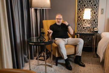 Mature businessman having video call