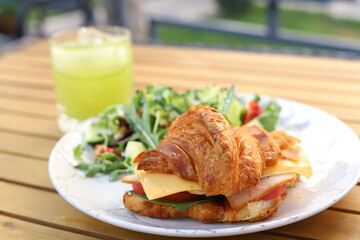 Fragrant croissant with beef bacon, spinach, avocado, poached egg and hollandaise sauce!