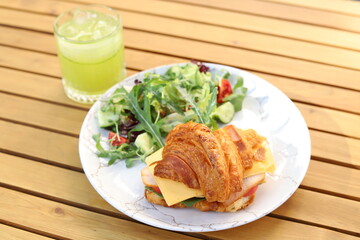 Fragrant croissant with beef bacon, spinach, avocado, poached egg and hollandaise sauce!