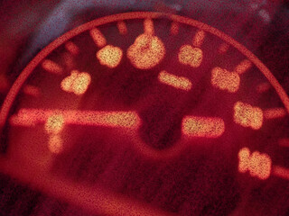 blur illustration of red flashing speedometer for abstract background