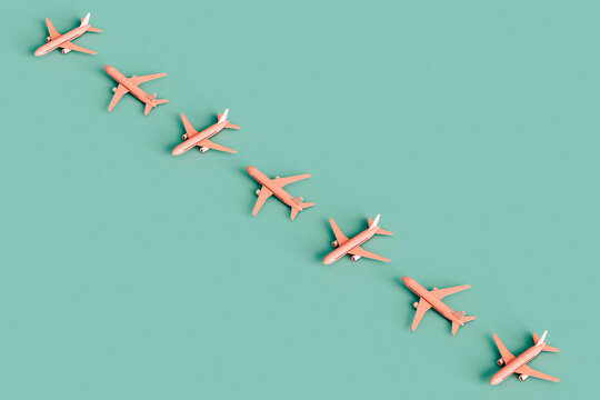 a row of Pink Commercial airplanes. Boing