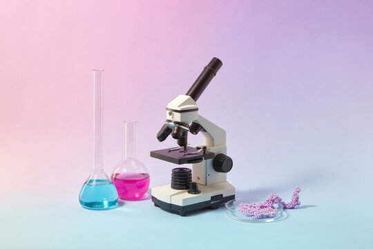 Microscope, test tubes and petri dish