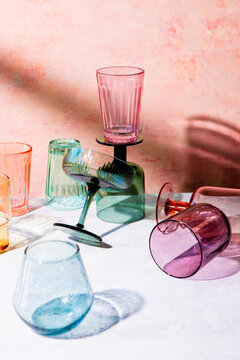 Coloured drinking glass pink background