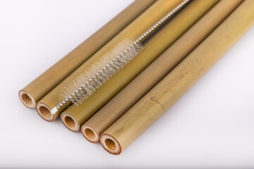 Bamboo straws on a white background. Ecological bamboo straws. Thanks to these bamboo straws, we can be a more environmentally conscious society. Say no to plastic.