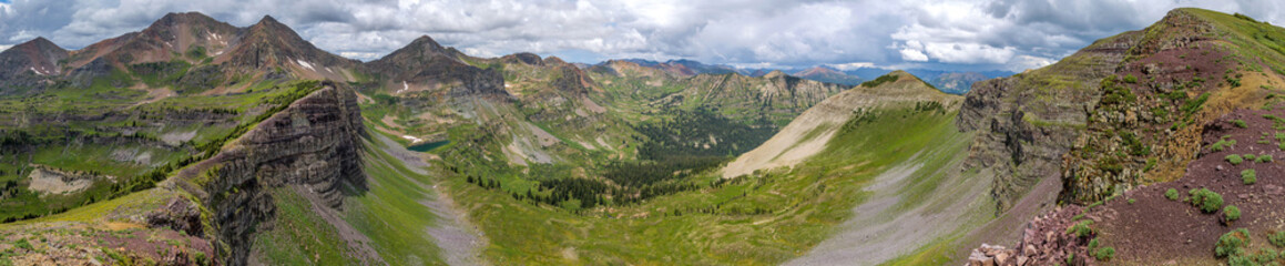 Fototapeta na wymiar Oh Be Joyful Valley - A panoramic Summer view of Oh-Be-Joyful Valley, surrounded by colorful Ruby Range and Scarp Ridge of Elk Mountains. Crested Butte, Colorado, USA. 