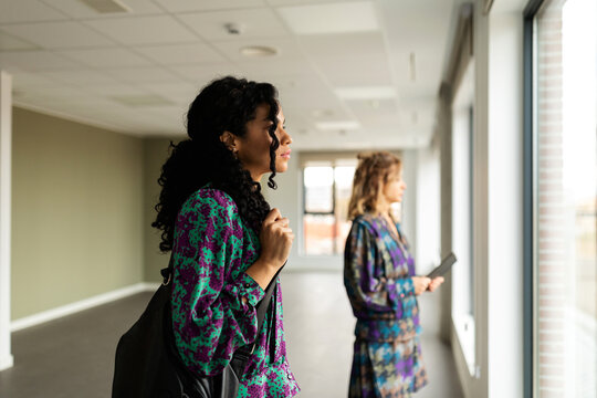 Stylish women looking at new workspace to rent