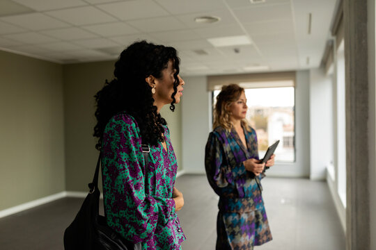 Female partners visiting new workspace to rent