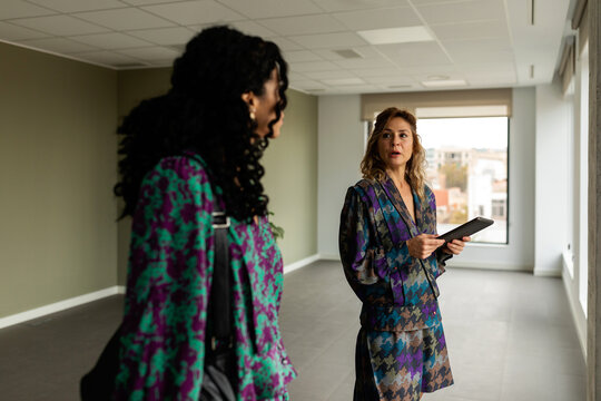 Business women visiting new office