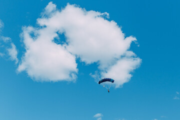 Obraz na płótnie Canvas Skydiver. Paratroopers. Parachute. Sky. Dome. Clouds. Liberty. Air.