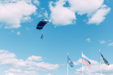 Skydiver. Paratroopers. Parachute. Sky. Dome. Clouds. Liberty. Air.