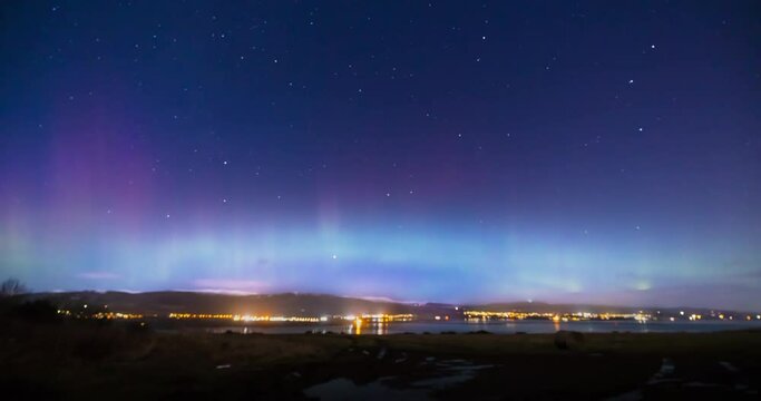 a view of the aurora borealis in the north west highlands of scotland during a clear spring night