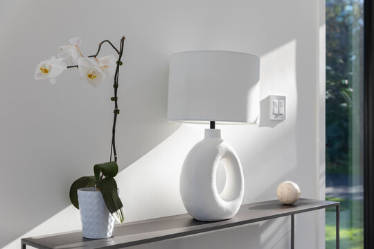 Modern Lamp On Table With Orchid 