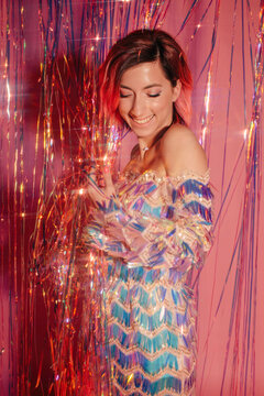 Fashion portrait of smiling woman in sequins dress