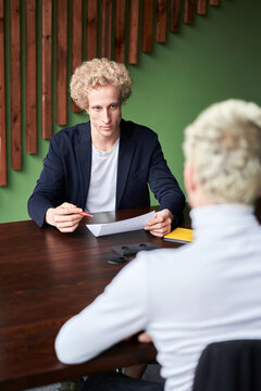 Blond men during interview in office