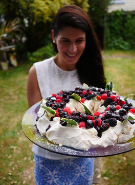 A woman with a decadent cake