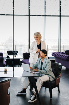 Businesswomen with laptop in coworking room