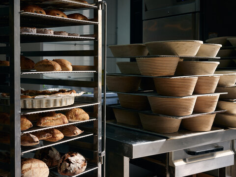 Bakery workshop with racks of delicious baked goods 