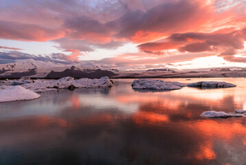 Glacier lagoon under a dramatic sky at sunset. Jokulsárlón, Iceland.