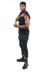 Naklejka premium person exhibiting vaccine with his thumb up the white background - full shot. High-quality photo