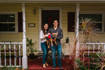 Happy couple with French bulldog