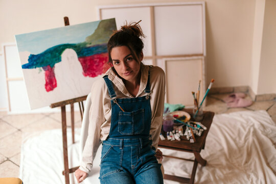 Young artist in her art studio