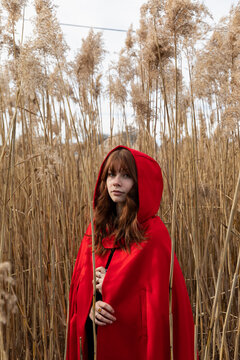 Redhead Fall fashion Girl in elegant Red cape Coat  