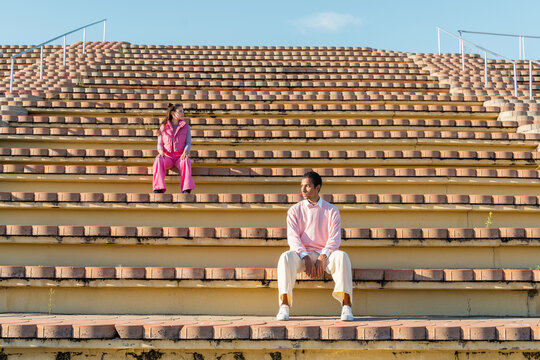 Dancer friends sitting on outdoor tier