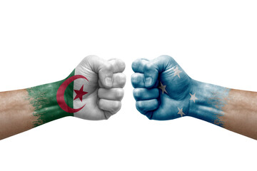 Two hands punch to each others on white background. Country flags painted fists, conflict crisis concept between algeria and micronesia