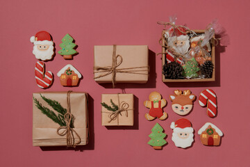 ginger biscuit and christmas decoration on red background