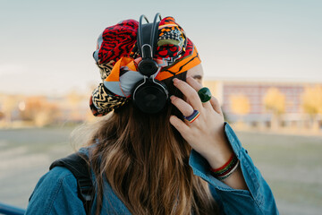 Modern woman listening music outdoor