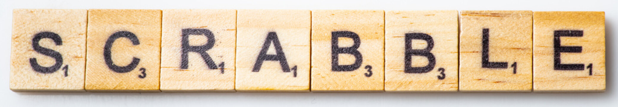 word scrabble in wooden scrabble tile letters on white background